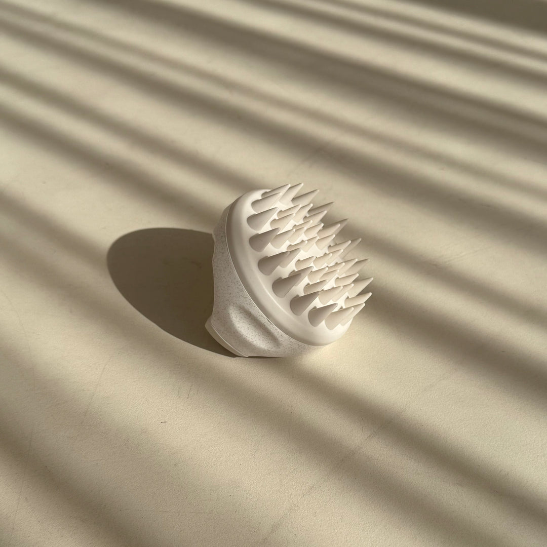 מברשת לעיסוי הקרקפת בז׳